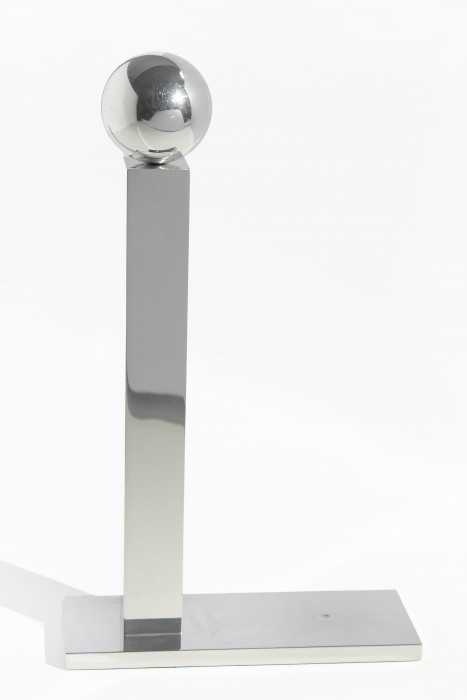 Small aluminum sphere atop an aluminum tower on the left side of an aluminum platform.