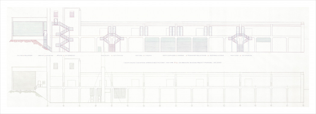 A blueprint illustrates two interior views of a long, two-story building and its staircases, roll-up doors, and windows.