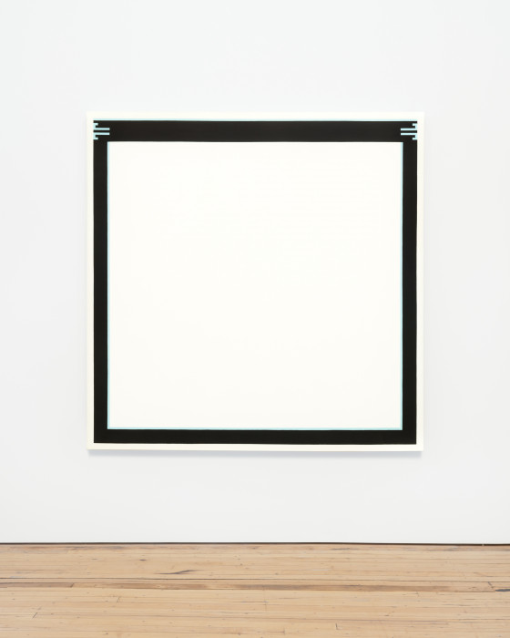 A large square white canvas with dark borders on a white wall. Inside the dark border is a thin light blue line on the right and left interior of the border, and in the top border on the right and left are short light blue lines at the right and left corners.