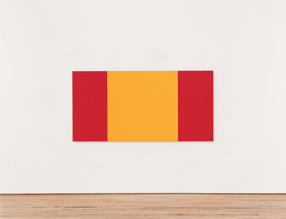 Rectangle with three vertical bands of color, two red on the outside and one wider yellow band in the center, hung on a white wall.