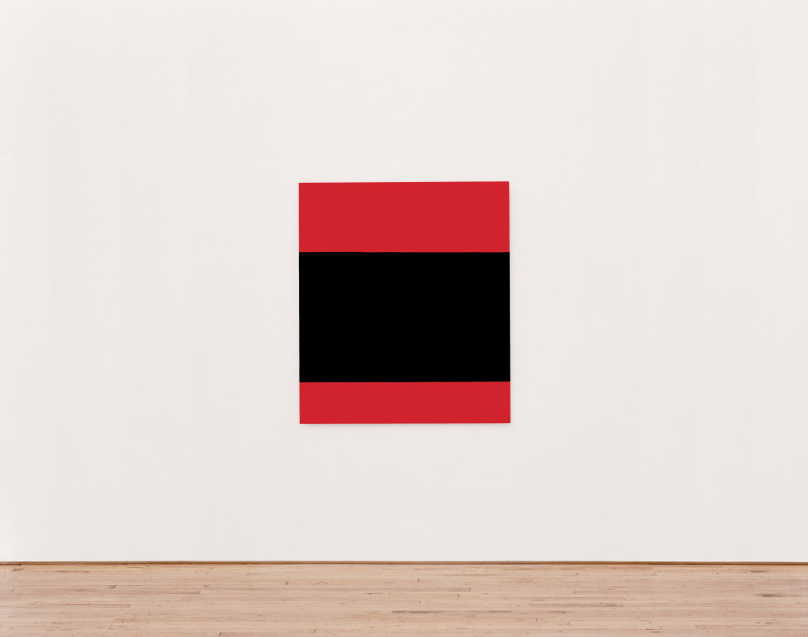 A rectangular canvas with three horizontal bands of colorÑred on the top and bottom and a wider black band in the centerÑhangs on a white wall.