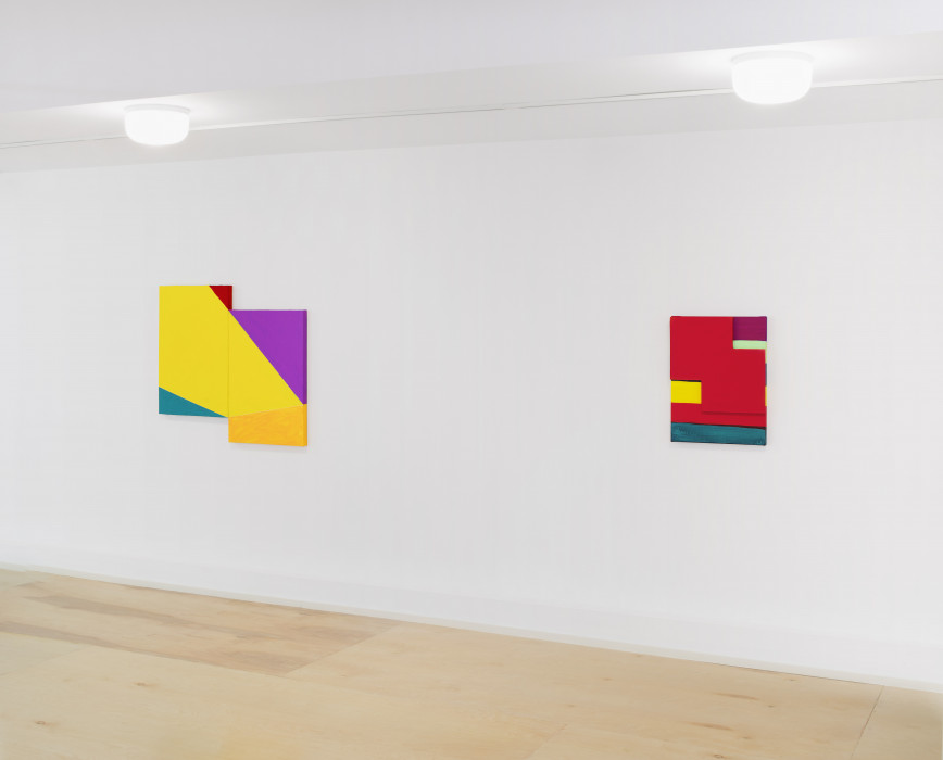 Two multicolored paintings hang on a white wall. The left painting is a diptych hung with both panels flush against each other with the left panel raised partially higher than the right. A thick yellow stripe runs diagonally down from the left panel into the right panel before running into a goldenrod block of color at the bottom fourth of the right panel. The bottom lefthand corner of the left panel is teal and the top righthand corner is red. The top righthand corner of the right panel is fuchsia. The right painting is portrait-oriented and horizontal stripes of fuchsia, lime green, teal, yellow, scarlet, and teal sit top to bottom. A scarlet shape of two overlapping squares sits on top of the painting.
