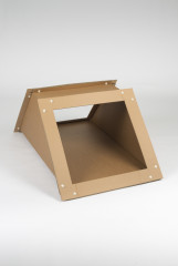 A brown industrial cardboard angular joint segment for square tubes sitting on its long side.
