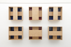6 wooden boxes, each has 2 strips of wood forming a cross over a red or blue interior.