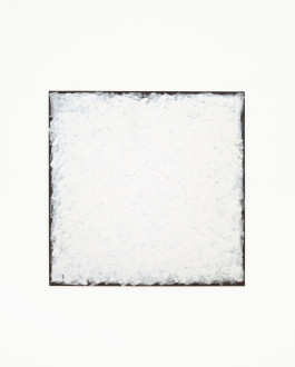 A square black board is painted nearly to the edges with small, rough strokes of white paint.