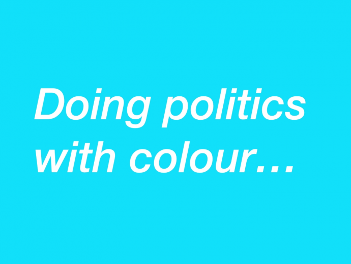 A blue graphic with the words in white italics letters: Doing politics with colour...